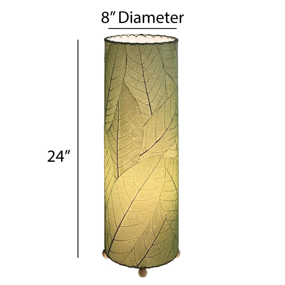 Crafted by the artisans of Eangee Home Design, the 24 Inch Cocoa Leaf Cylinder Table Lamp in green against a clean backdrop, featuring fossilized cocoa leaf shade, fair trade, eco friendly, sustainably sourced, handcrafted.