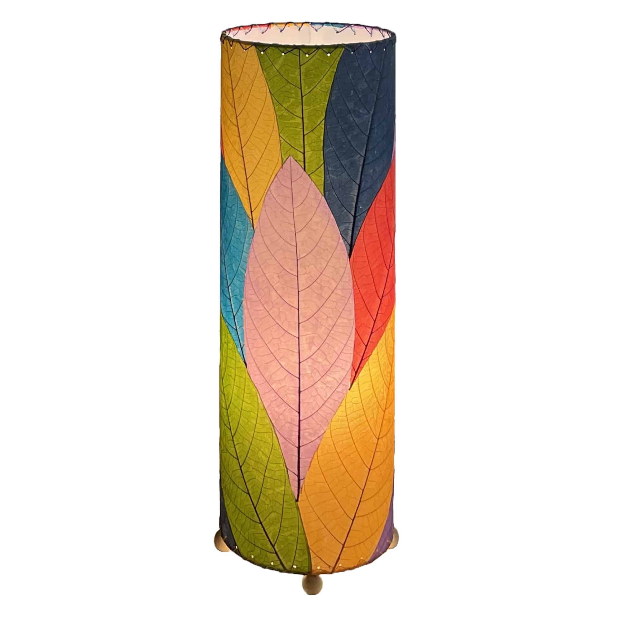 Crafted by the artisans of Eangee Home Design, the 24 Inch Cocoa Leaf Cylinder Table Lamp in multi color against a clean backdrop, featuring fossilized cocoa leaf shade, fair trade, eco friendly, sustainably sourced, handcrafted.