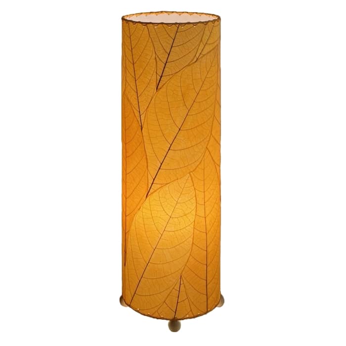 Crafted by the artisans of Eangee Home Design, the 24 Inch Cocoa Leaf Cylinder Table Lamp in orange against a clean backdrop, featuring fossilized cocoa leaf shade, fair trade, eco friendly, sustainably sourced, handcrafted.