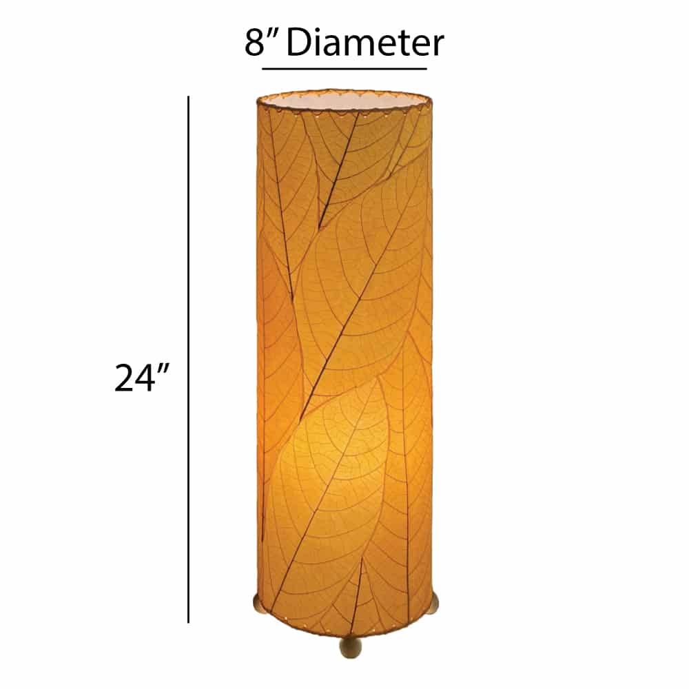 Crafted by the artisans of Eangee Home Design, the 24 Inch Cocoa Leaf Cylinder Table Lamp in orange against a clean backdrop, featuring fossilized cocoa leaf shade, fair trade, eco friendly, sustainably sourced, handcrafted.