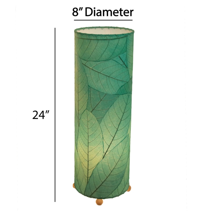 Crafted by the artisans of Eangee Home Design, the 24 Inch Cocoa Leaf Cylinder Table Lamp in sea blue against a clean backdrop, featuring fossilized cocoa leaf shade, fair trade, eco friendly, sustainably sourced, handcrafted.