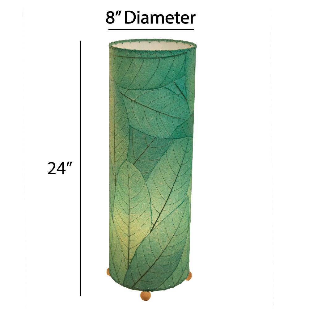 Crafted by the artisans of Eangee Home Design, the 24 Inch Cocoa Leaf Cylinder Table Lamp in sea blue against a clean backdrop, featuring fossilized cocoa leaf shade, fair trade, eco friendly, sustainably sourced, handcrafted.
