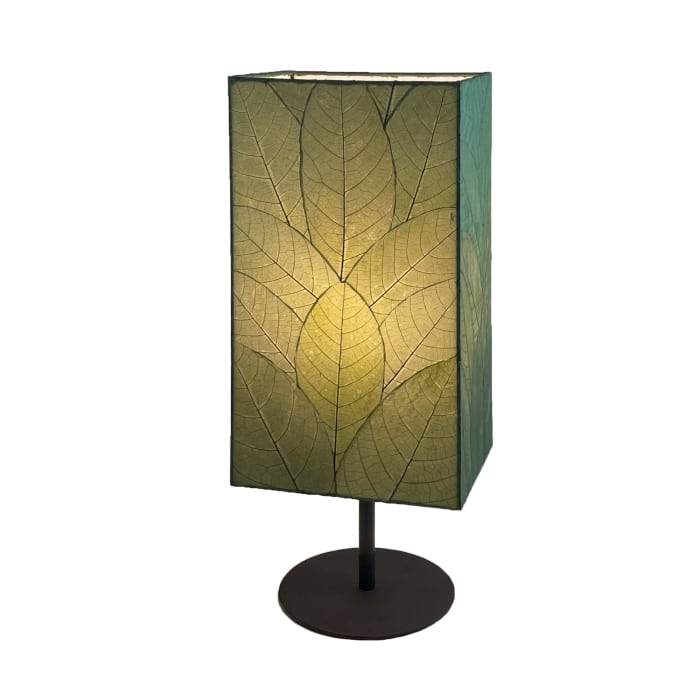 Crafted by the artisans of Eangee Home Design, the Sequoia Table Lamp in green against a clean backdrop, featuring fossilized cocoa leaf shade, fair trade, sustainably sourced.