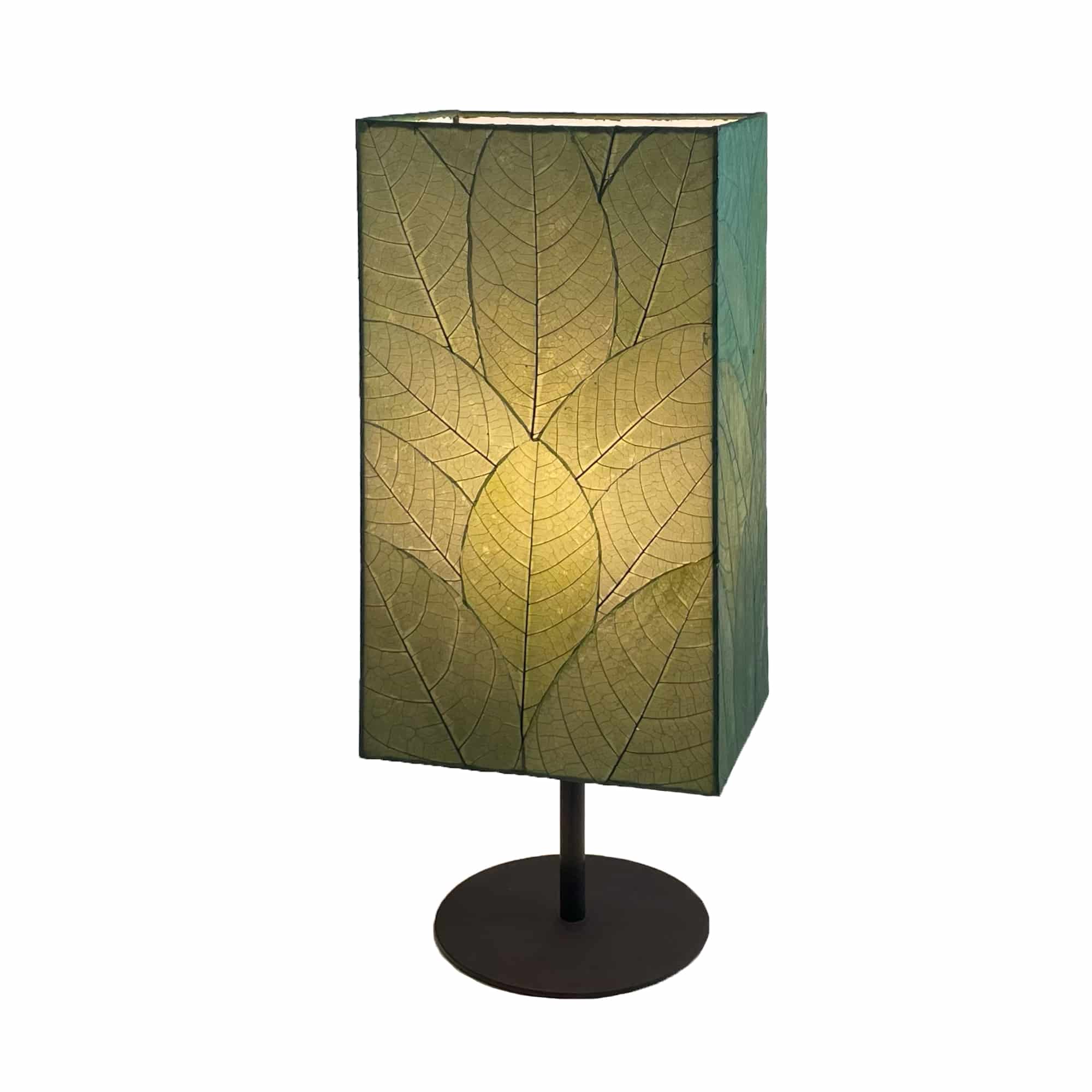 Crafted by the artisans of Eangee Home Design, the Sequoia Table Lamp in green against a clean backdrop, featuring fossilized cocoa leaf shade, fair trade, sustainably sourced.