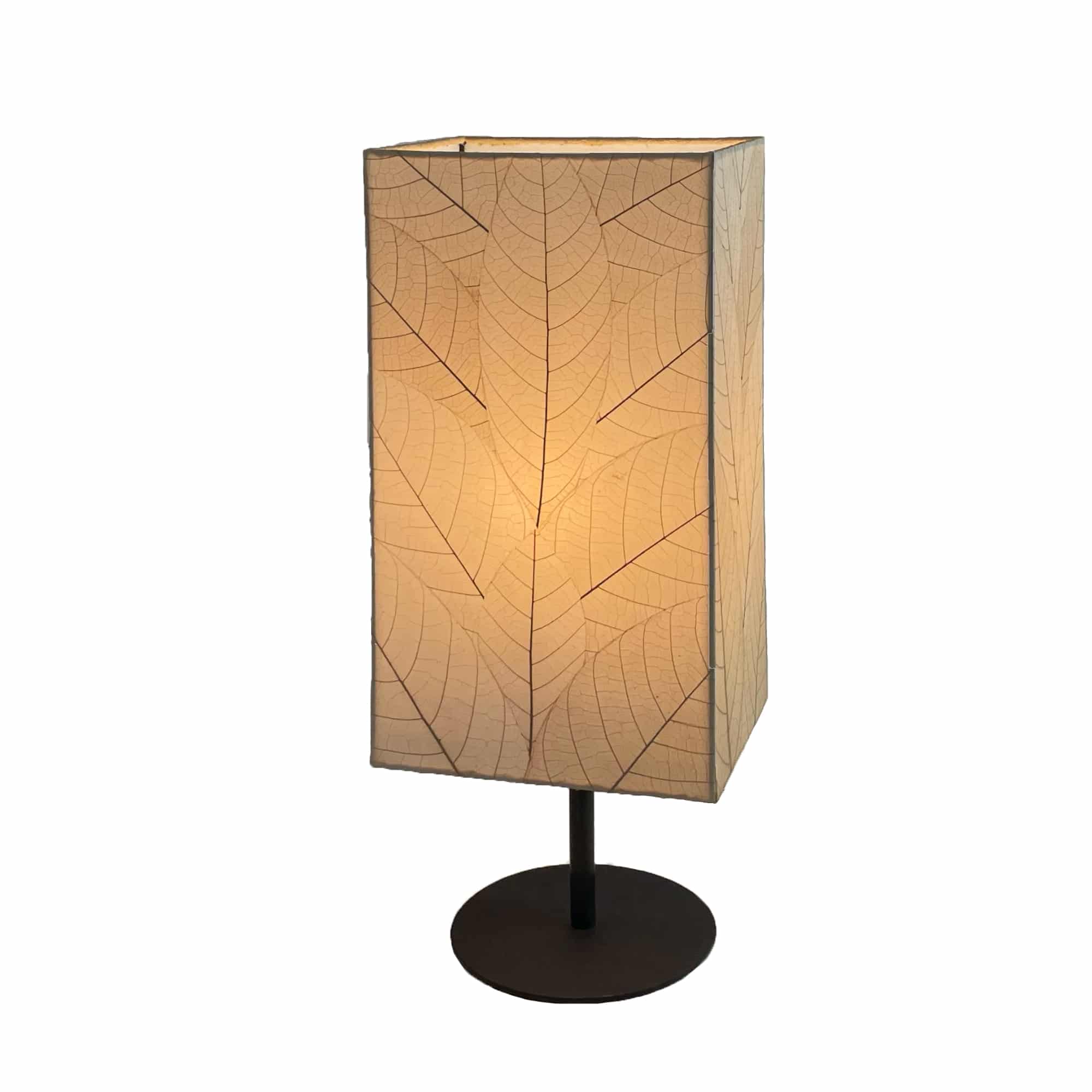 Crafted by the artisans of Eangee Home Design, the Sequoia Table Lamp in natural against a clean backdrop, featuring fossilized cocoa leaf shade, fair trade, sustainably sourced.
