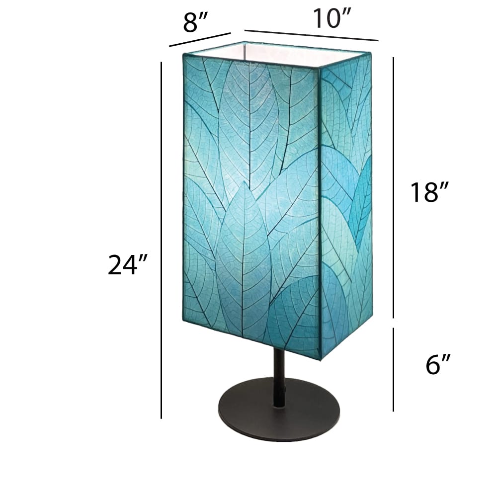 Crafted by the artisans of Eangee Home Design, the Sequoia Table Lamp in sea blue against a clean backdrop, featuring fossilized cocoa leaf shade, fair trade, sustainably sourced.