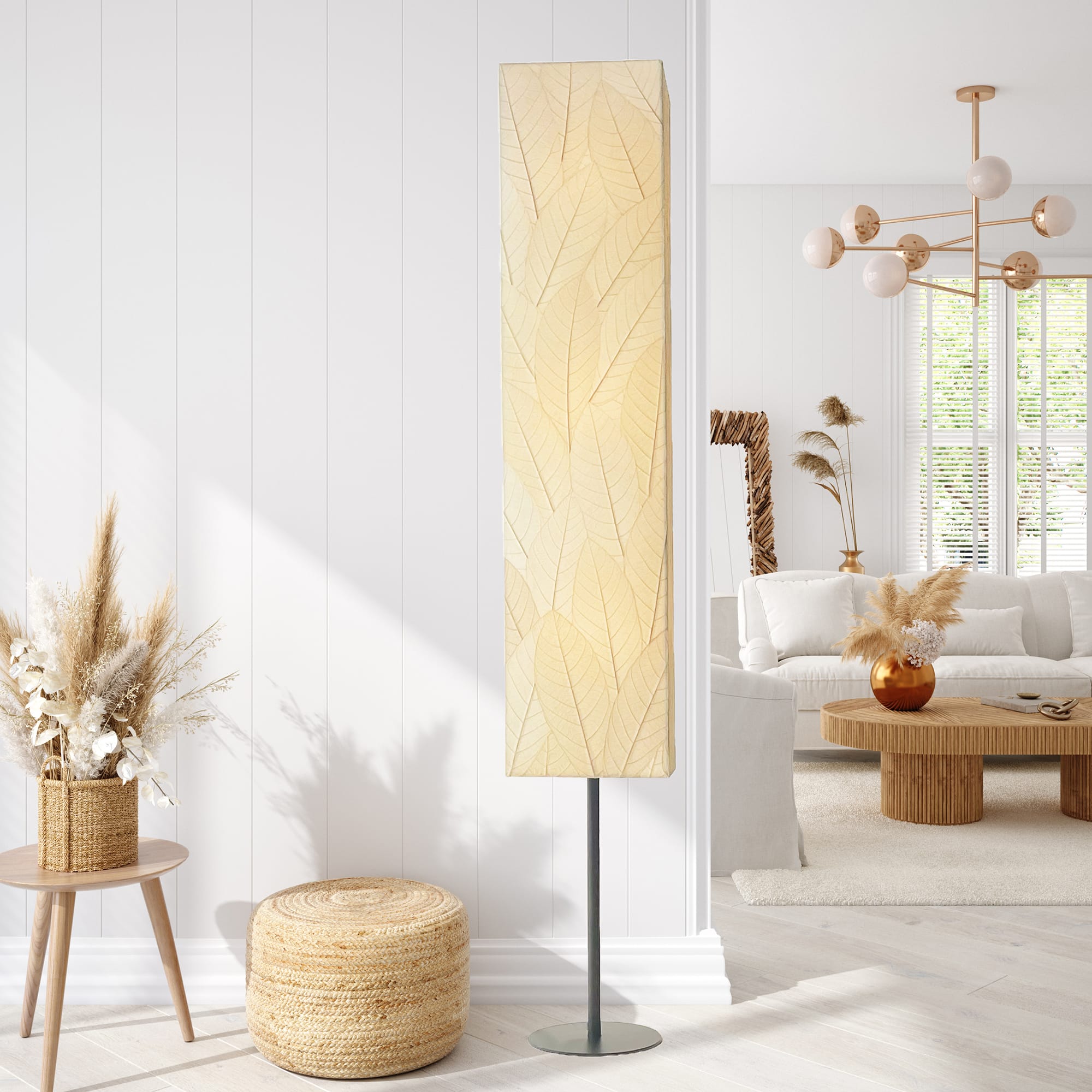 Crafted by the artisans of Eangee Home Design, the Sequoia Giant Floor Lamp in natural against a clean backdrop, featuring fossilized cocoa leaf shade, fair trade, handcrafted.