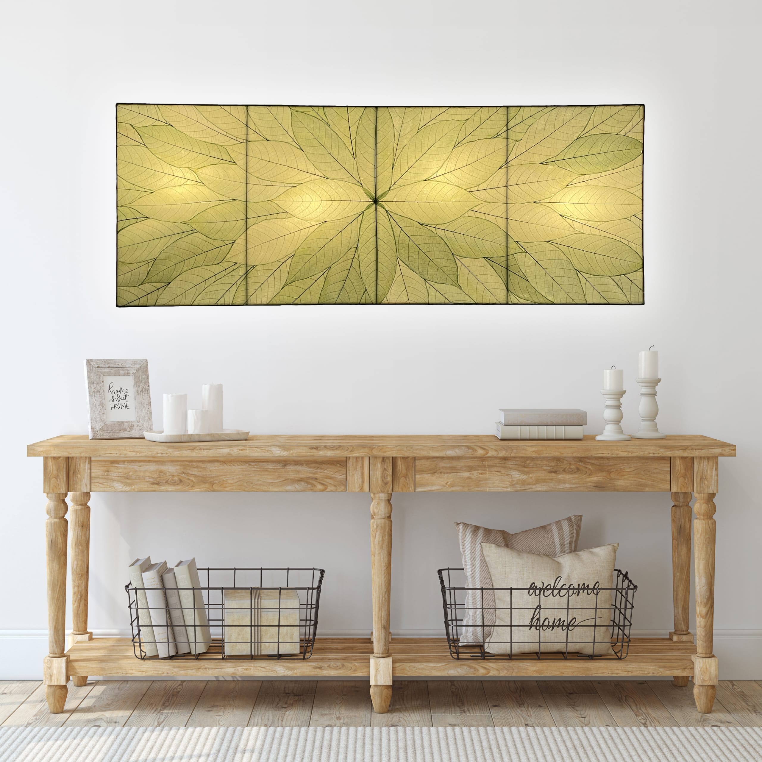 Crafted by the artisans of Eangee Home Design, the Sunburst Panel Wall Lamp in green against a clean backdrop, featuring fossilized cocoa leaf shade, fair trade.