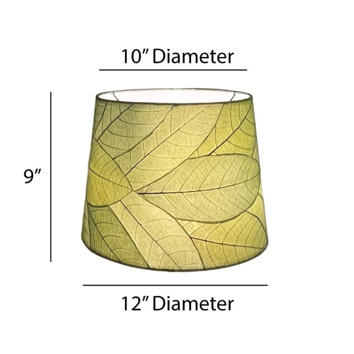 Crafted by the artisans of Eangee Home Design, the 12 Inch Tapered Drum Shade in green against a clean backdrop, featuring fossilized cocoa leaf shade, fair trade.