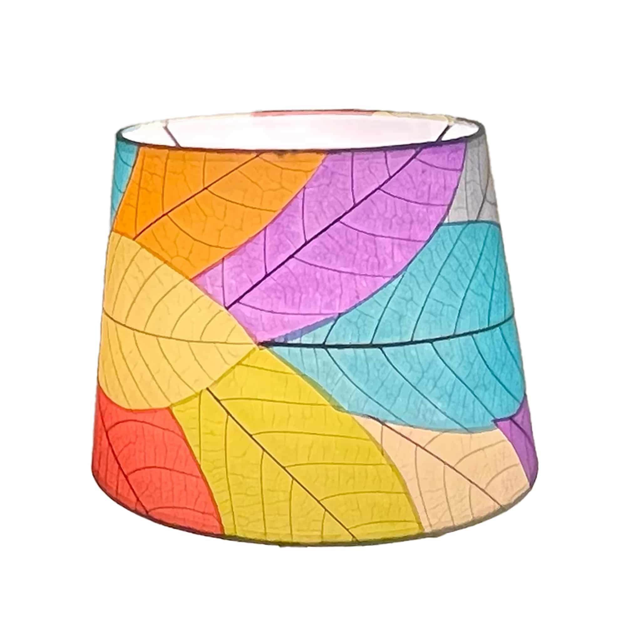 Crafted by the artisans of Eangee Home Design, the 12 Inch Tapered Drum Shade in multi color against a clean backdrop, featuring fossilized cocoa leaf shade, fair trade.