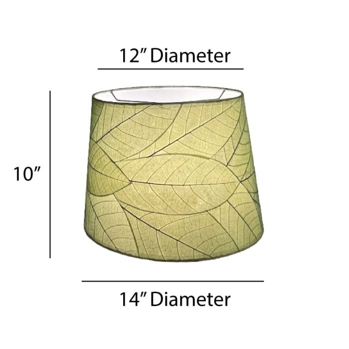 Crafted by the artisans of Eangee Home Design, the 14 Inch Tapered Drum Shade in green against a clean backdrop, featuring fossilized cocoa leaf shade, wrought iron frame, fair trade, eco friendly, sustainably sourced, handcrafted.