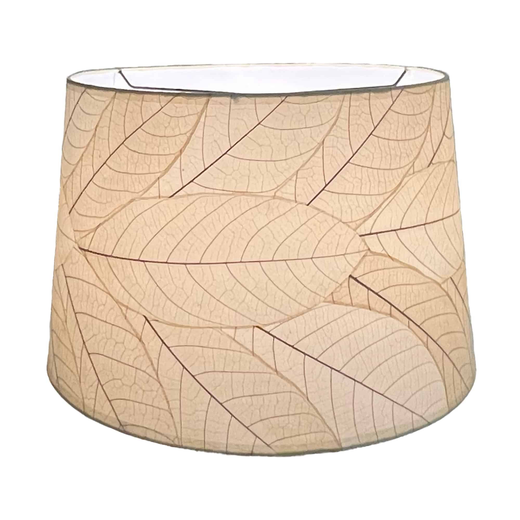 Crafted by the artisans of Eangee Home Design, the 18 Inch Tapered Drum Shade in natural against a clean backdrop, featuring fossilized cocoa leaf shade, wrought iron frame, eco friendly, sustainably sourced.