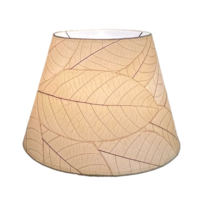 Crafted by the artisans of Eangee Home Design, the 16 Inch British Empire Shade in natural against a clean backdrop, featuring fossilized cocoa leaf shade, wrought iron frame, fair trade, eco friendly, sustainably sourced.
