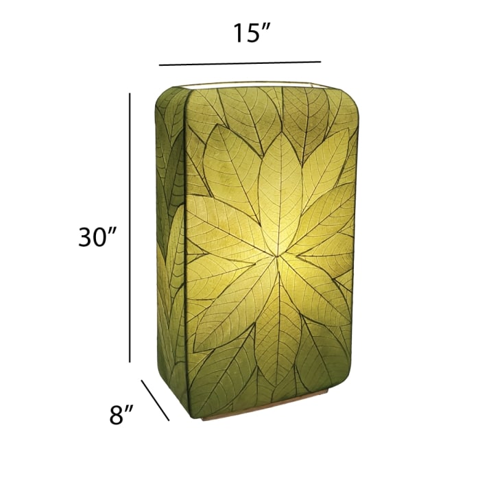 Crafted by the artisans of Eangee Home Design, the Sunburst Giant Floor Lamp in green against a clean backdrop, featuring fossilized cocoa leaf shade, fair trade, handcrafted.