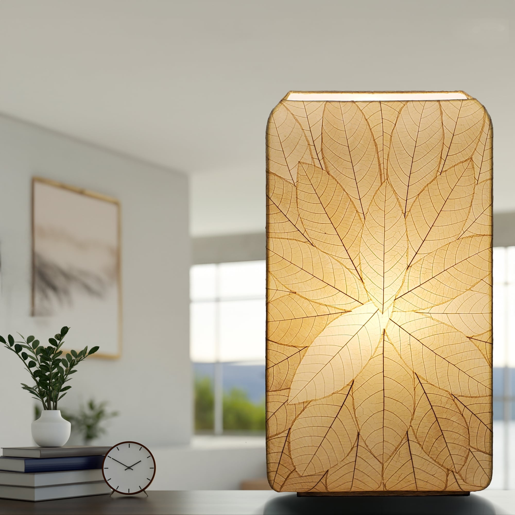 In a sun drenched entryway, crafted by the artisans of Eangee Home Design, the Sunburst Giant Floor Lamp in natural stands gracefully, featuring fossilized cocoa leaf shade, fair trade, handcrafted, adding warmth and character to the space.