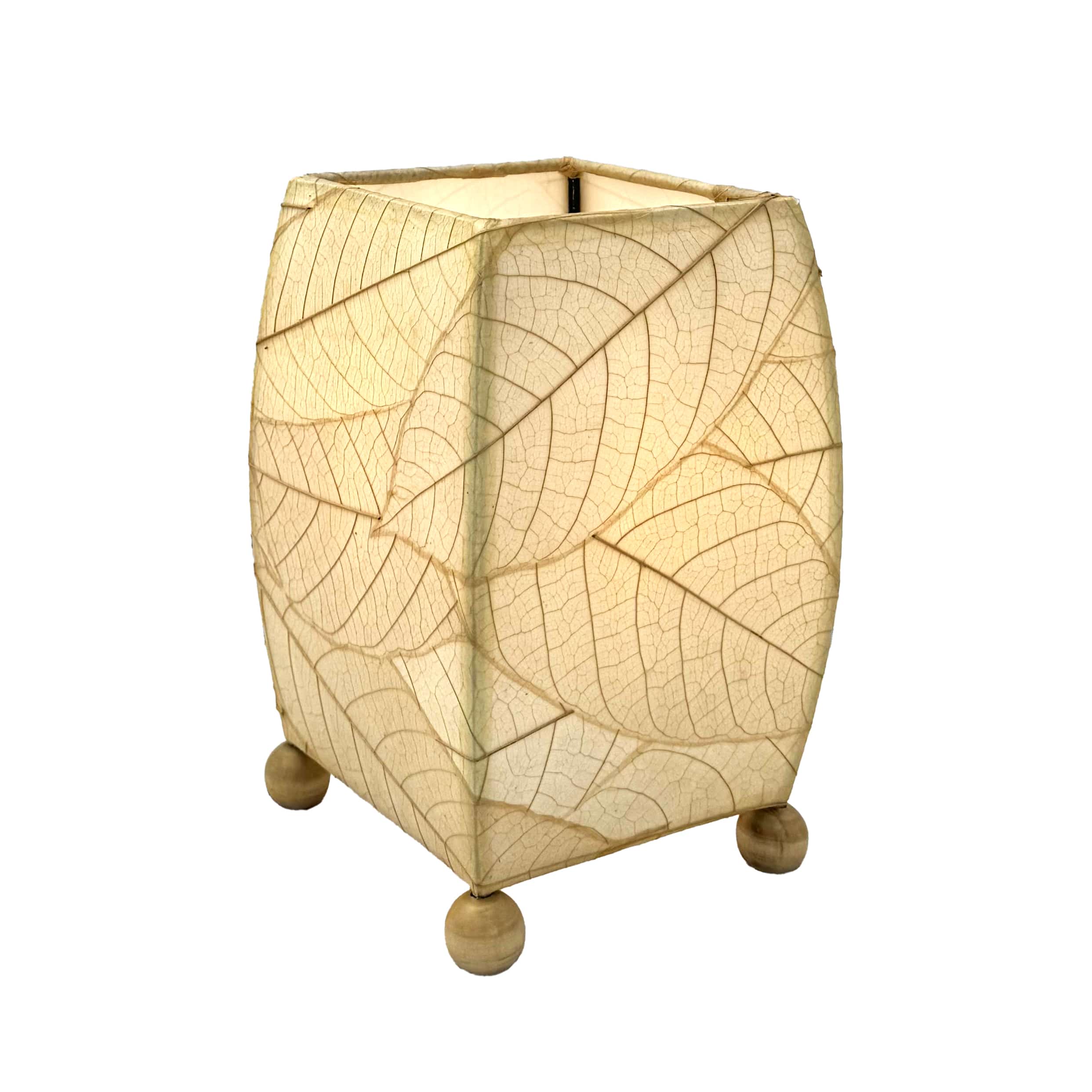 Crafted by the artisans of Eangee Home Design, the Mini Square Cocoa Leaf Table Lamp in natural against a clean backdrop, featuring fossilized cocoa leaf shade, wrought iron frame, fair trade, eco friendly, sustainably sourced, handcrafted.