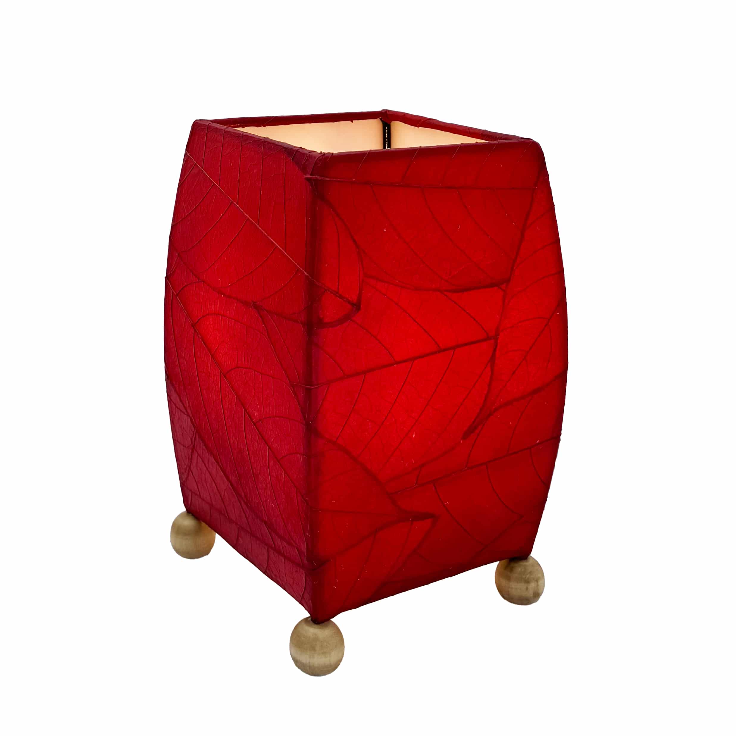 Crafted by the artisans of Eangee Home Design, the Mini Square Cocoa Leaf Table Lamp in red against a clean backdrop, featuring fossilized cocoa leaf shade, wrought iron frame, fair trade, eco friendly, sustainably sourced, handcrafted.