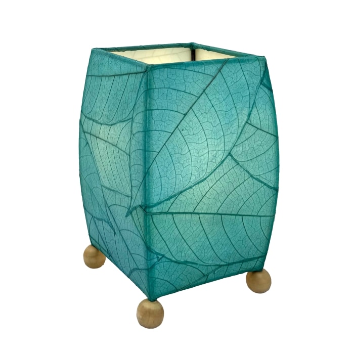 Crafted by the artisans of Eangee Home Design, the Mini Square Cocoa Leaf Table Lamp in sea blue against a clean backdrop, featuring fossilized cocoa leaf shade, wrought iron frame, fair trade, eco friendly, sustainably sourced, handcrafted.