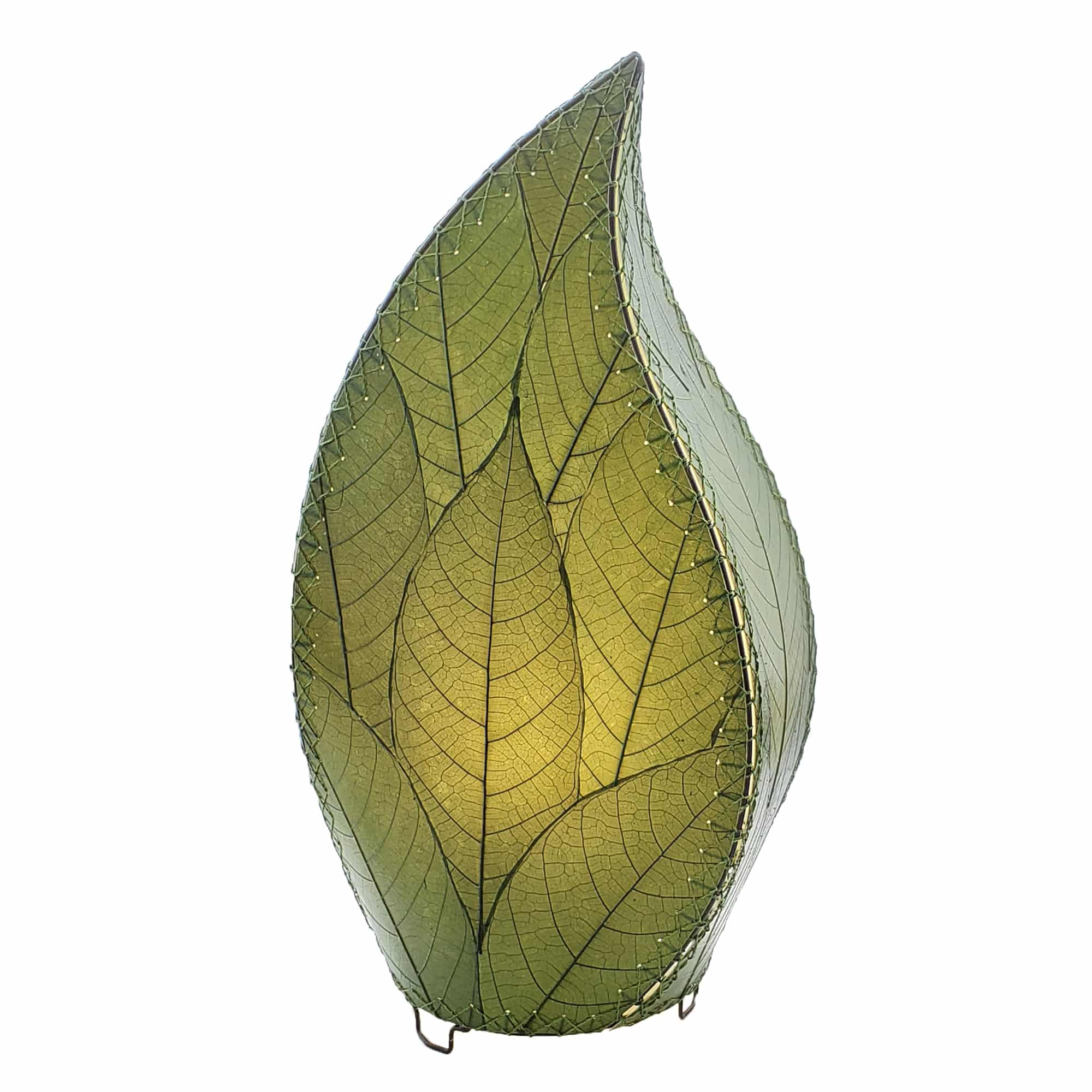In a modern interior with earth tones, crafted by the artisans of Eangee Home Design, the 24 Inch Leaflet Lamp in green stands gracefully, featuring fossilized cocoa leaf shade, abaca rope accents, wrought iron frame, handcrafted, adding warmth and character to the space.