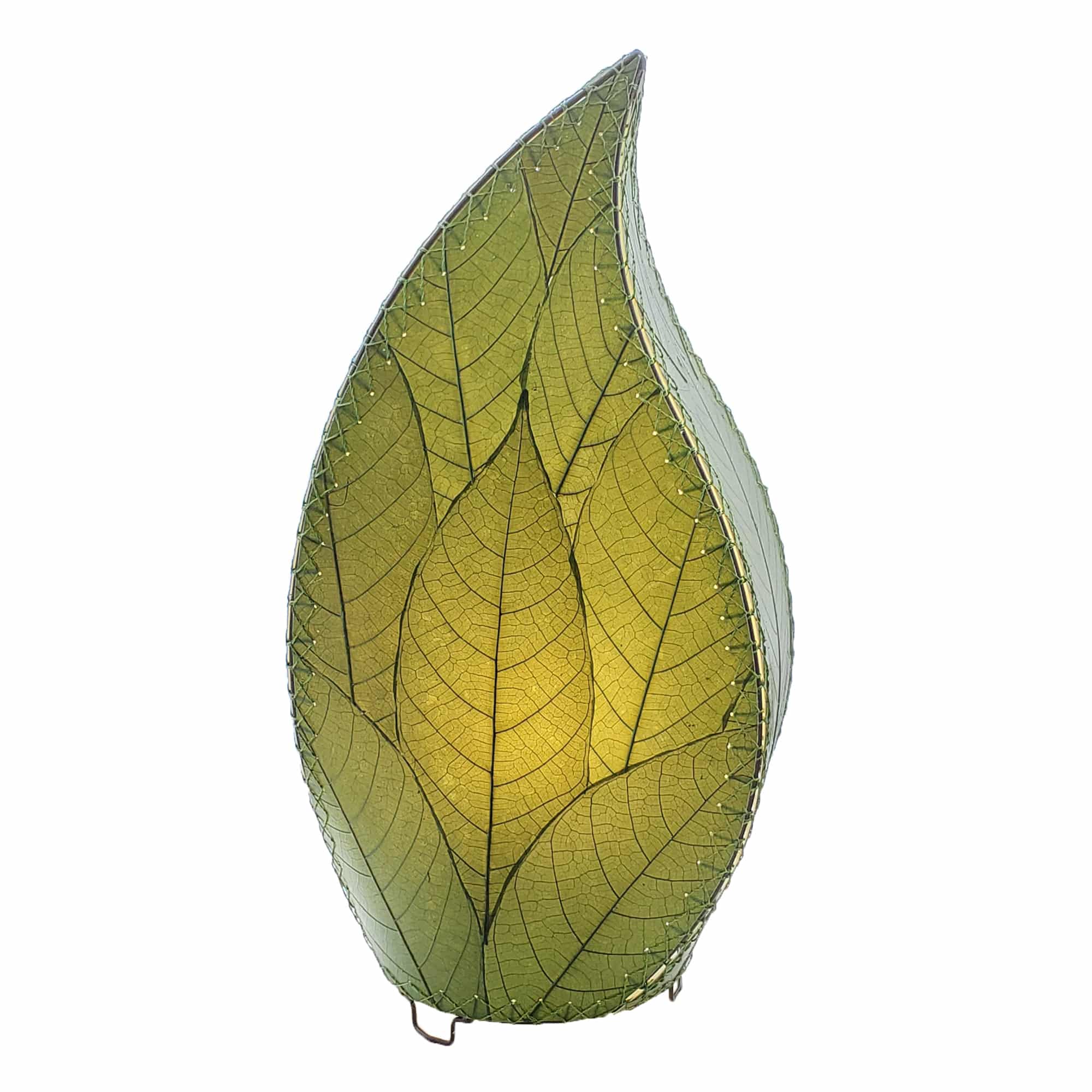 In a softly lit reading nook, crafted by the artisans of Eangee Home Design, the 24 Inch Leaflet Lamp in green stands gracefully, featuring fossilized cocoa leaf shade, abaca rope accents, wrought iron frame, handcrafted, adding warmth and character to the space.