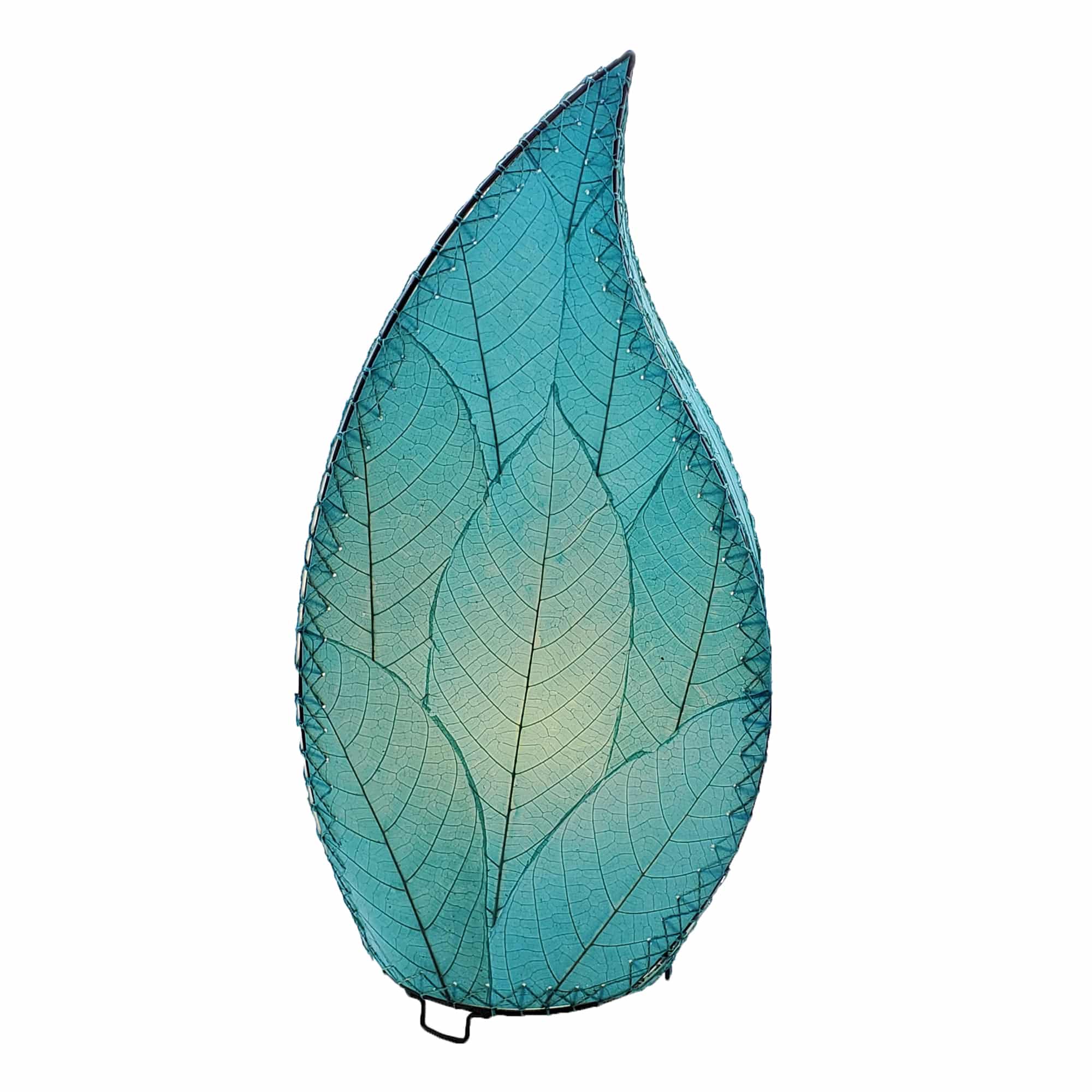 In a softly lit reading nook, crafted by the artisans of Eangee Home Design, the 24 Inch Leaflet Lamp in sea blue stands gracefully, featuring fossilized cocoa leaf shade, abaca rope accents, wrought iron frame, handcrafted, adding warmth and character to the space.
