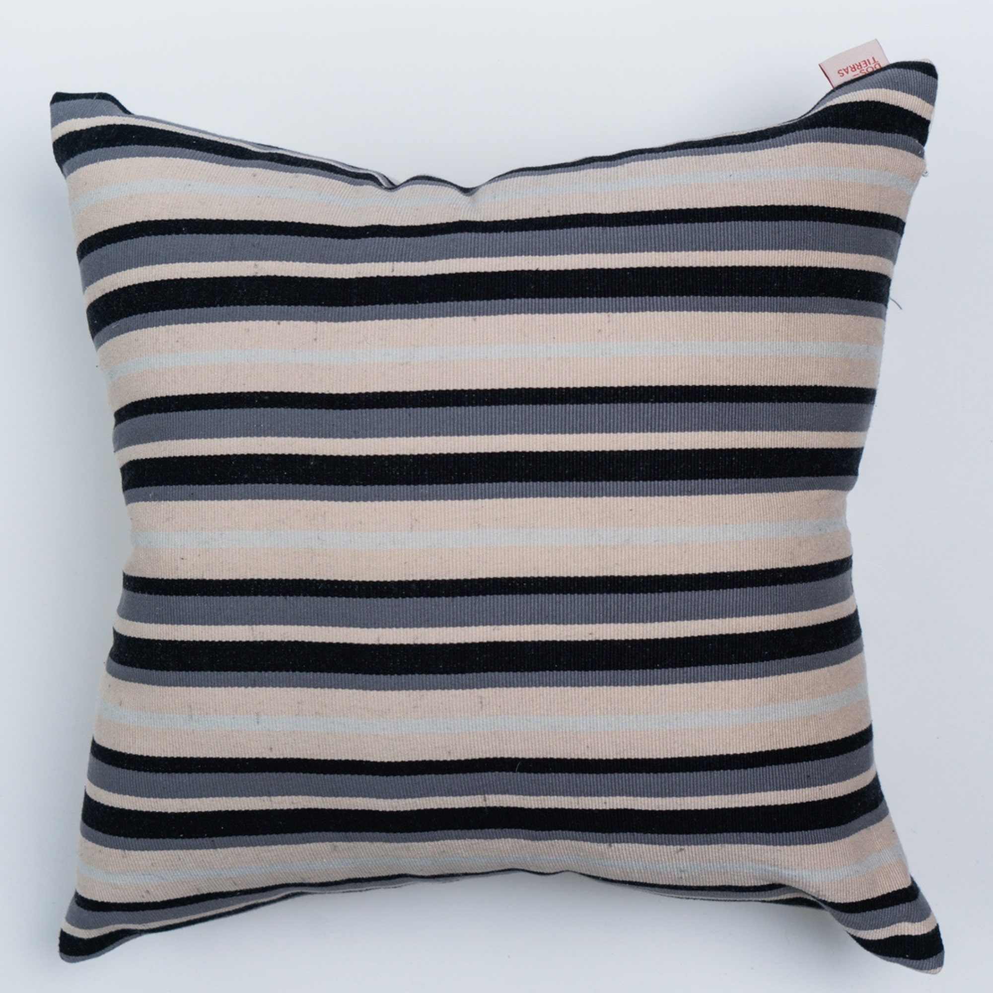 Black outdoor pillow crafted by the artisans of Magnolia Casual called the Rayitas Pillow Gray Black featuring traditional backstrap loom weave, handwoven textile, handcrafted shown against a clean backdrop featuring shades of gray and black.