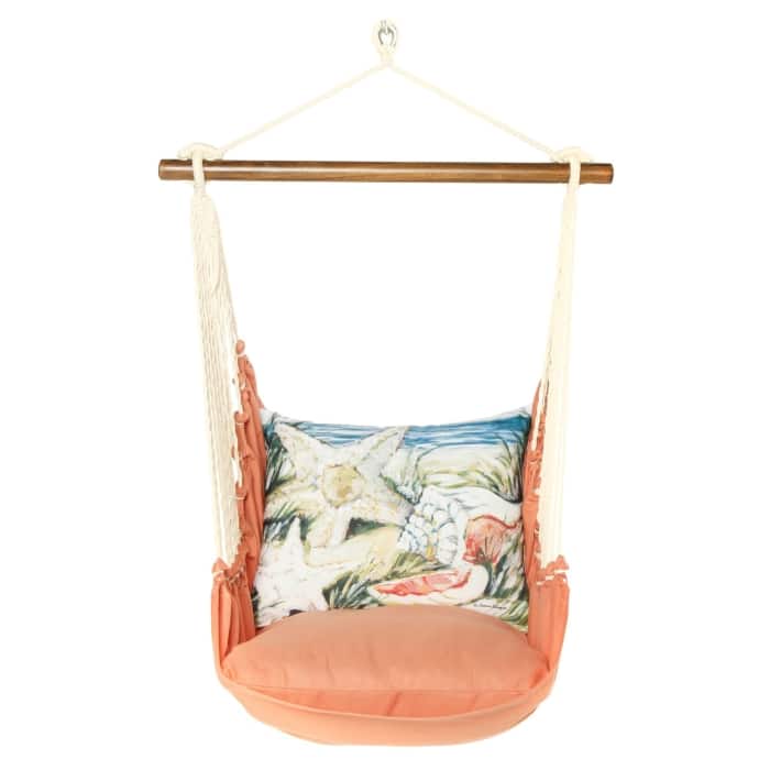 Multi colored outdoor swing crafted by the artisans of Magnolia Casual called the Swing Set 4 piece Living Coral w/ Seashells featuring 100 percent weather resistant fabric, weather resistant polyester fabric, handcrafted shown against a clean backdrop featuring with a coral motif and shades of coral.