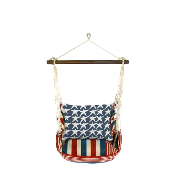 Multi colored outdoor swing crafted by the artisans of Magnolia Casual called the Swing Set 4 piece Stars & Stripes w/ Flag Stars featuring 100 percent weather resistant fabric, weather resistant polyester fabric, handcrafted shown against a clean backdrop featuring with a stripes motif.