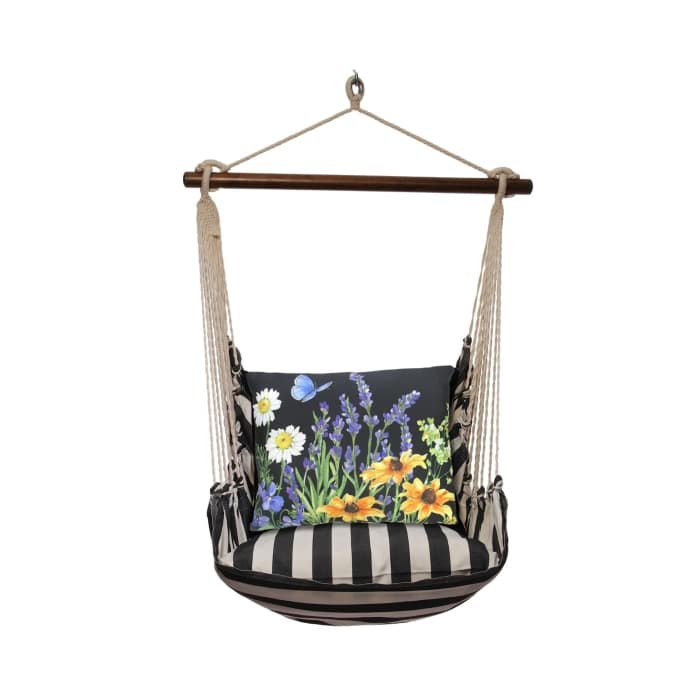 Black outdoor swing crafted by the artisans of Magnolia Casual called the Swing Set 4 piece True Black Stripe w/ Garden Meadow 1 featuring 100 percent weather resistant fabric, weather resistant polyester fabric, handcrafted shown against a clean backdrop featuring with a stripe motif and shades of black.