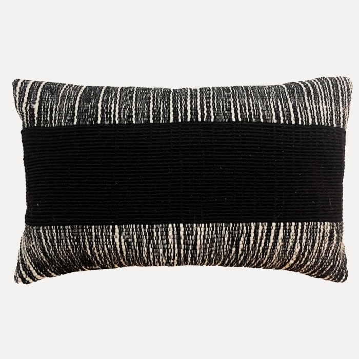 Black pillow cover crafted by the artisans of Dos Tierras called the Wool Lumbar Pillow Cover Black featuring handwoven textile, handcrafted shown against a clean backdrop featuring shades of black.