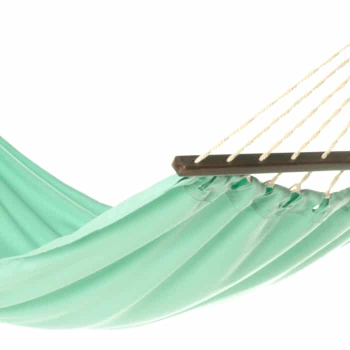 Green outdoor textile crafted by the artisans of Magnolia Casual called the Hammock Seafoam Green Solid featuring 100 percent weather resistant fabric, weather resistant polyester fabric, sustainably sourced, artisan shown against a clean backdrop featuring shades of green.