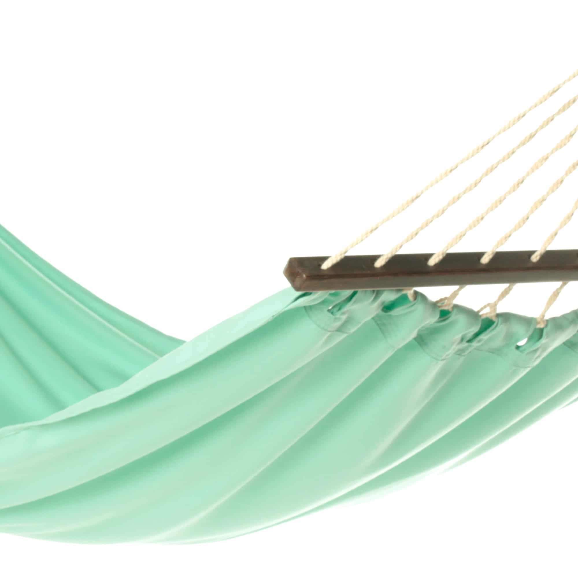 Green outdoor textile crafted by the artisans of Magnolia Casual called the Hammock Seafoam Green Solid featuring 100 percent weather resistant fabric, weather resistant polyester fabric, sustainably sourced, artisan shown against a clean backdrop featuring shades of green.