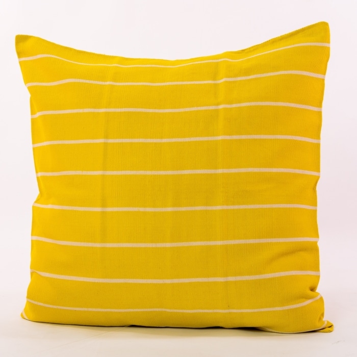 Yellow pillow cover crafted by the artisans of Magnolia Casual called the Rayas 2 Pillow Cover Yellow featuring handwoven textile, handcrafted shown against a clean backdrop featuring shades of yellow.