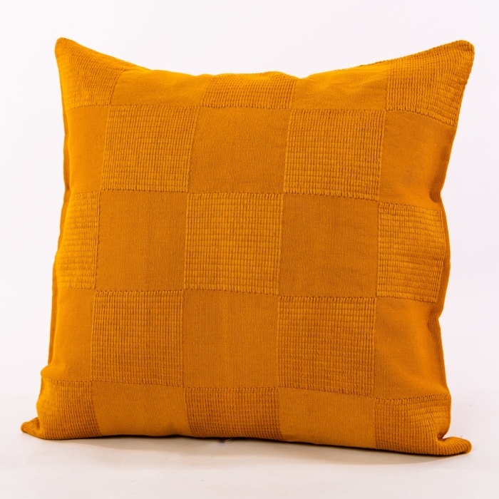 Gold pillow cover crafted by the artisans of Dos Tierras called the Chess Pillow Cover Gold featuring handwoven textile, handcrafted shown against a clean backdrop featuring shades of gold.