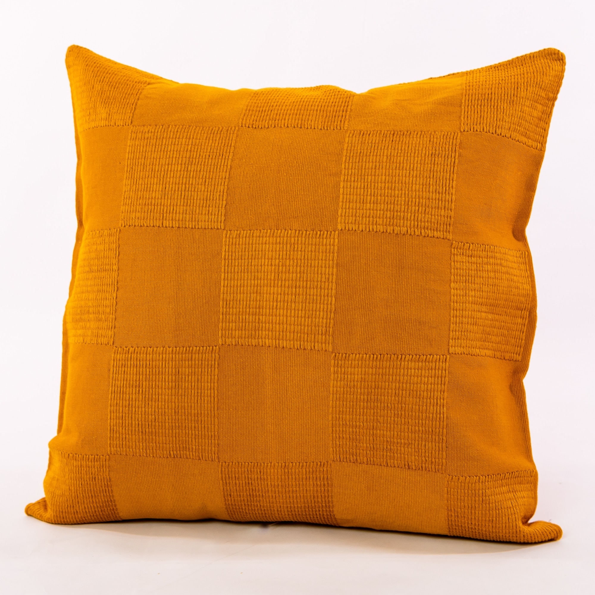 Gold pillow cover crafted by the artisans of Dos Tierras called the Chess Pillow Cover Gold featuring handwoven textile, handcrafted shown against a clean backdrop featuring shades of gold.
