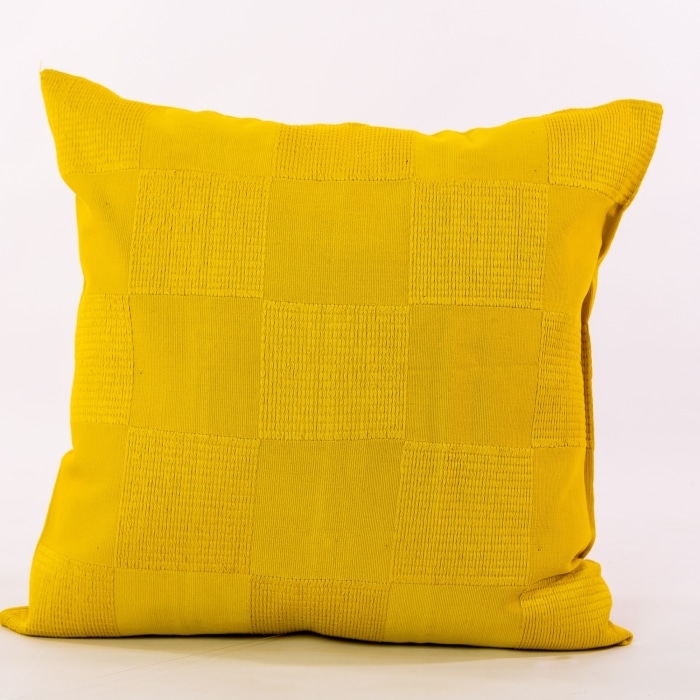 Yellow pillow cover crafted by the artisans of Dos Tierras called the Chess Pillow Cover Yellow featuring handwoven textile, handcrafted shown against a clean backdrop featuring shades of yellow.