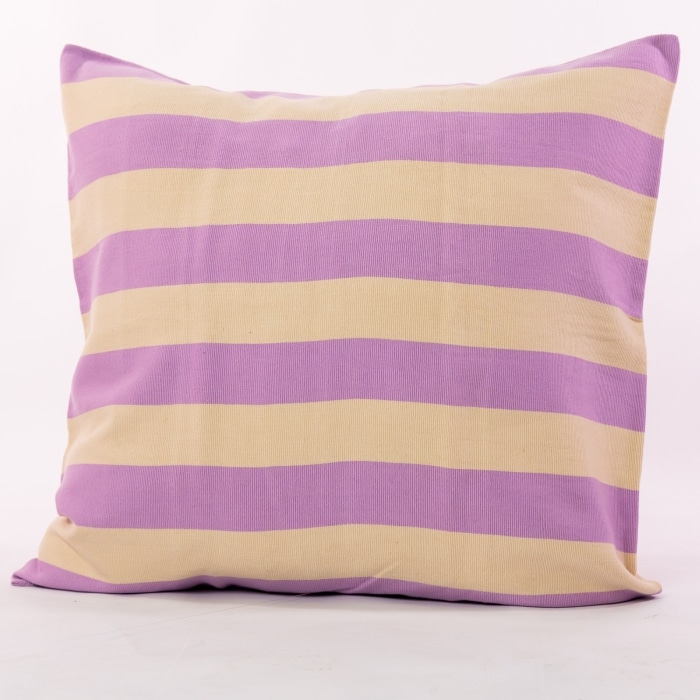 Purple pillow cover crafted by the artisans of Magnolia Casual called the Rayas Pillow Cover Purple featuring handwoven textile, handcrafted shown against a clean backdrop featuring shades of purple.