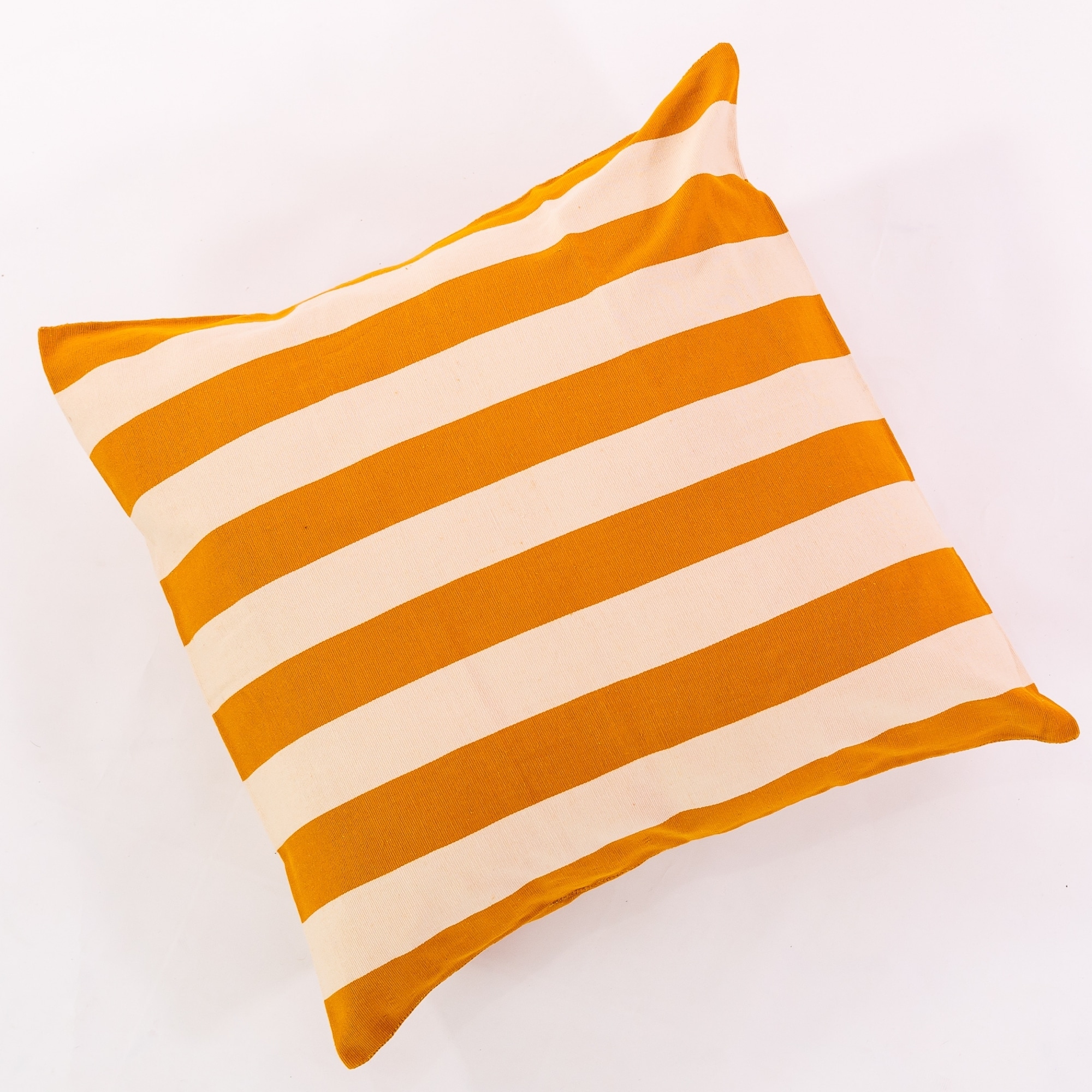 Gold pillow cover crafted by the artisans of Magnolia Casual called the Rayas Pillow Cover Gold featuring handwoven textile, handcrafted shown against a clean backdrop featuring shades of gold.