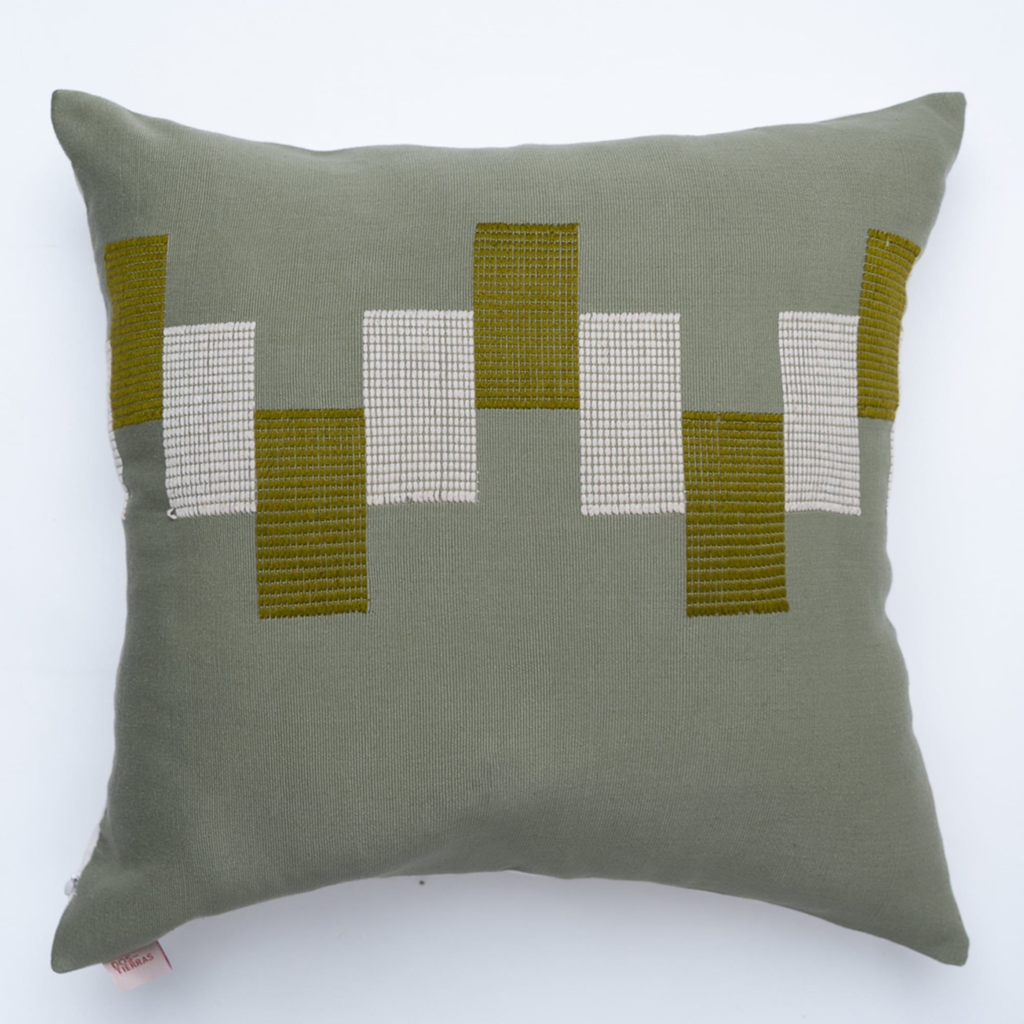 Green pillow cover crafted by the artisans of Dos Tierras called the Ve Pillow Cover Green featuring traditional backstrap loom weave, handwoven textile, handcrafted shown against a clean backdrop featuring shades of green.