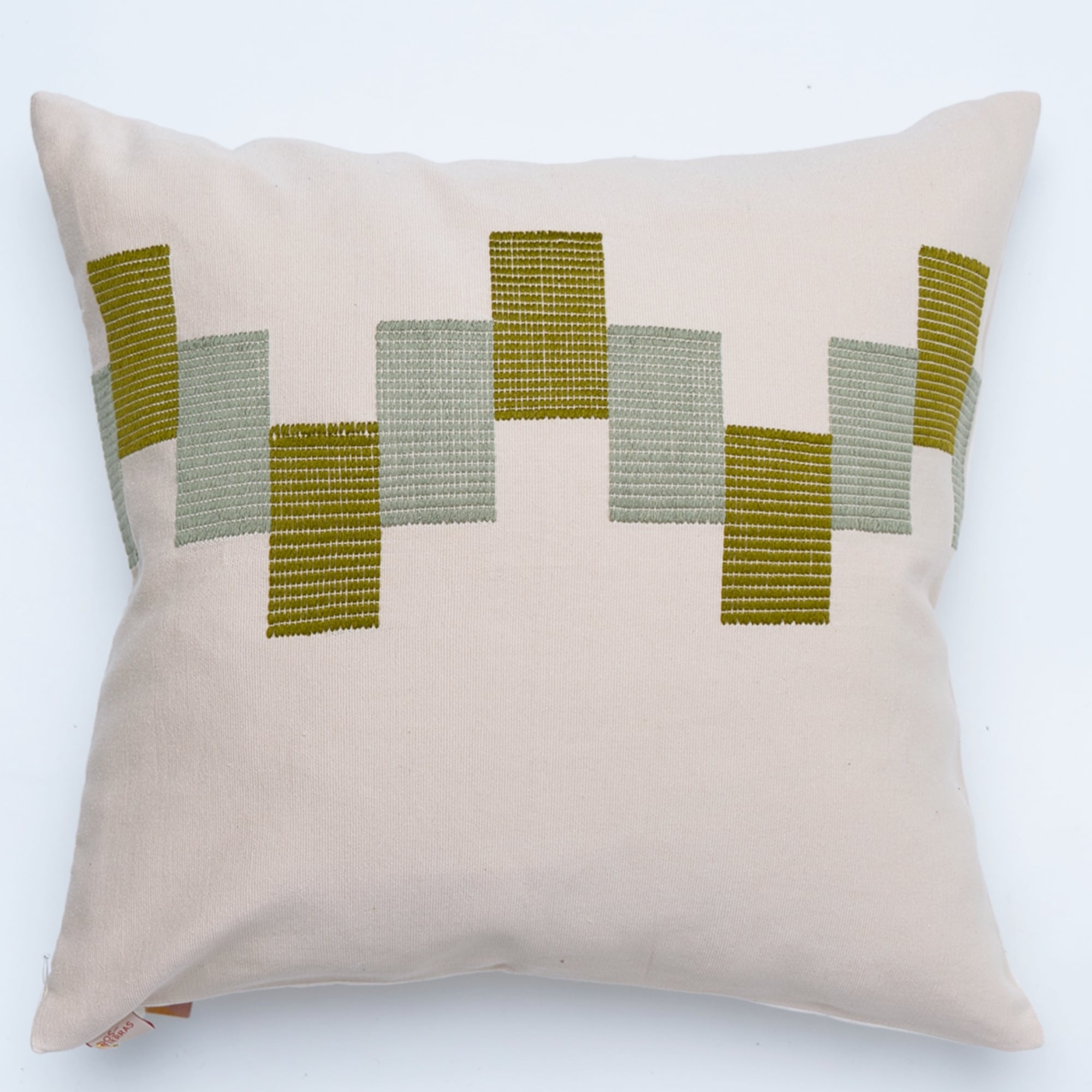 Green pillow cover crafted by the artisans of Dos Tierras called the Ve Pillow Cover Green Beige featuring traditional backstrap loom weave, handwoven textile, handcrafted shown against a clean backdrop featuring shades of green and beige.