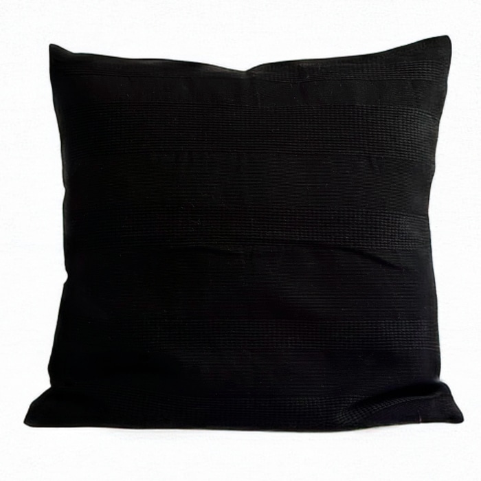 Black pillow cover crafted by the artisans of Magnolia Casual called the Lines Pillow Cover Black featuring handwoven textile, handcrafted shown against a clean backdrop featuring shades of black.