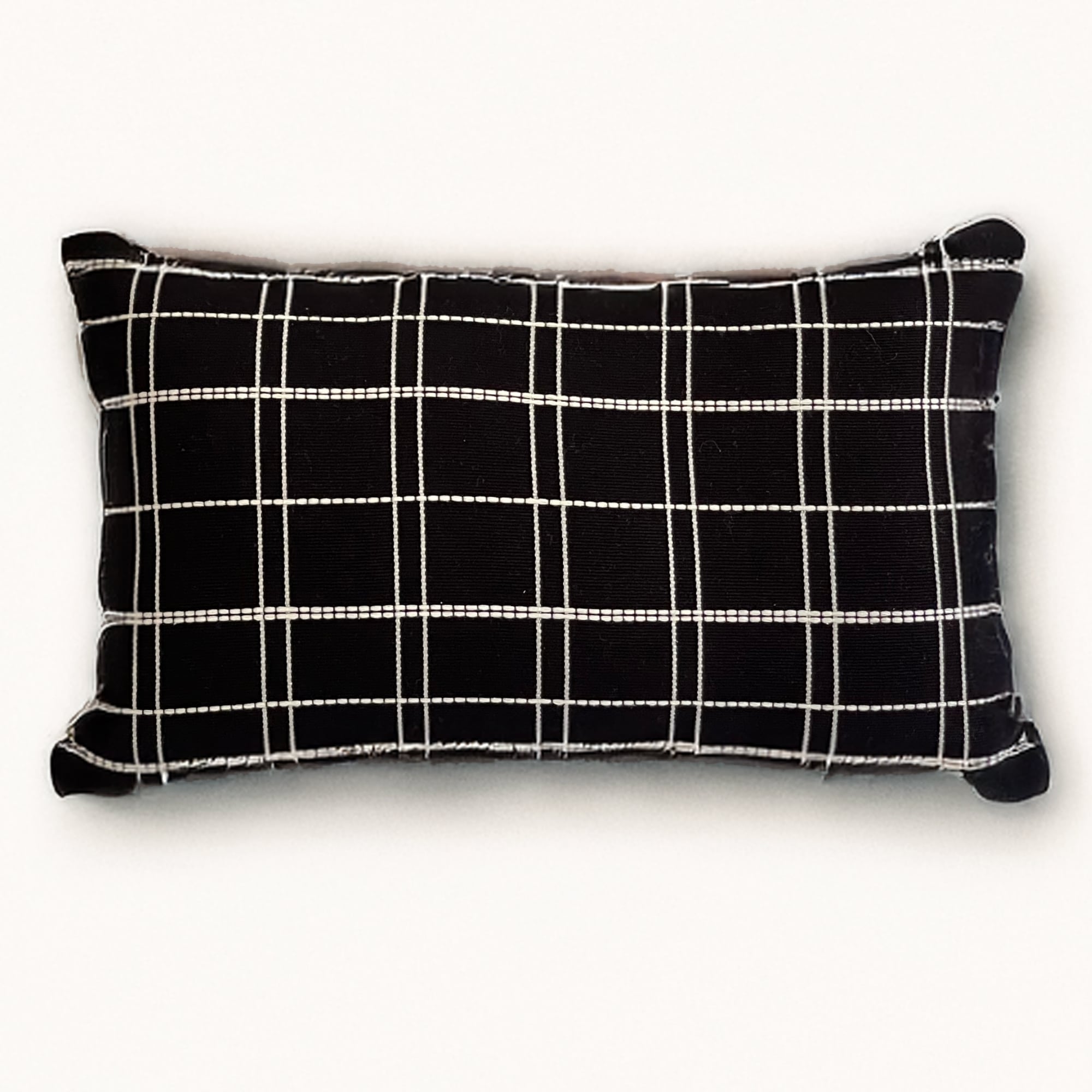 Black pillow cover crafted by the artisans of Dos Tierras called the Grid Lumbar Pillow Cover Black featuring handwoven textile, handcrafted shown against a clean backdrop featuring with a grid motif and shades of black.