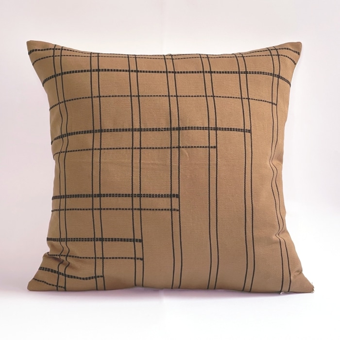 Tan pillow cover crafted by the artisans of Dos Tierras called the Broken Grid Pillow Cover Tan featuring handwoven textile, handcrafted shown against a clean backdrop featuring with a grid motif.
