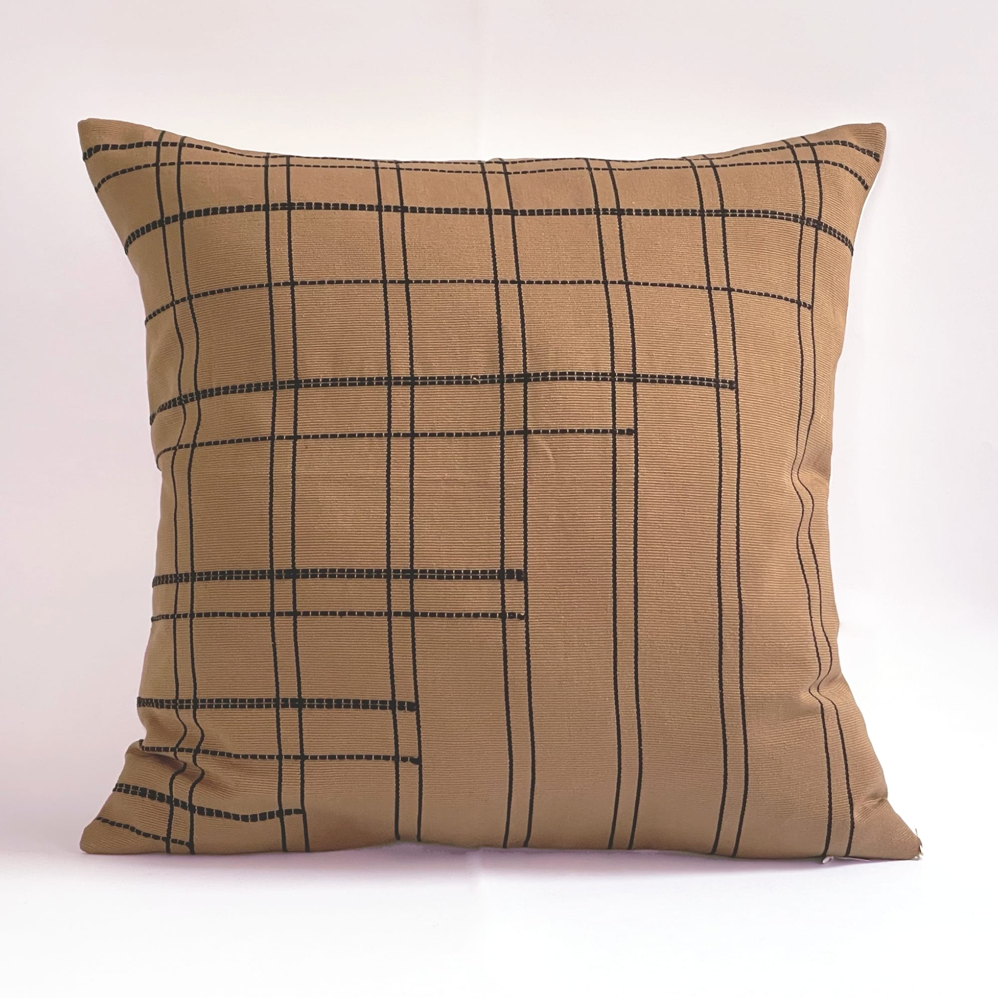 Tan pillow cover crafted by the artisans of Dos Tierras called the Broken Grid Pillow Cover Tan featuring handwoven textile, handcrafted shown against a clean backdrop featuring with a grid motif.