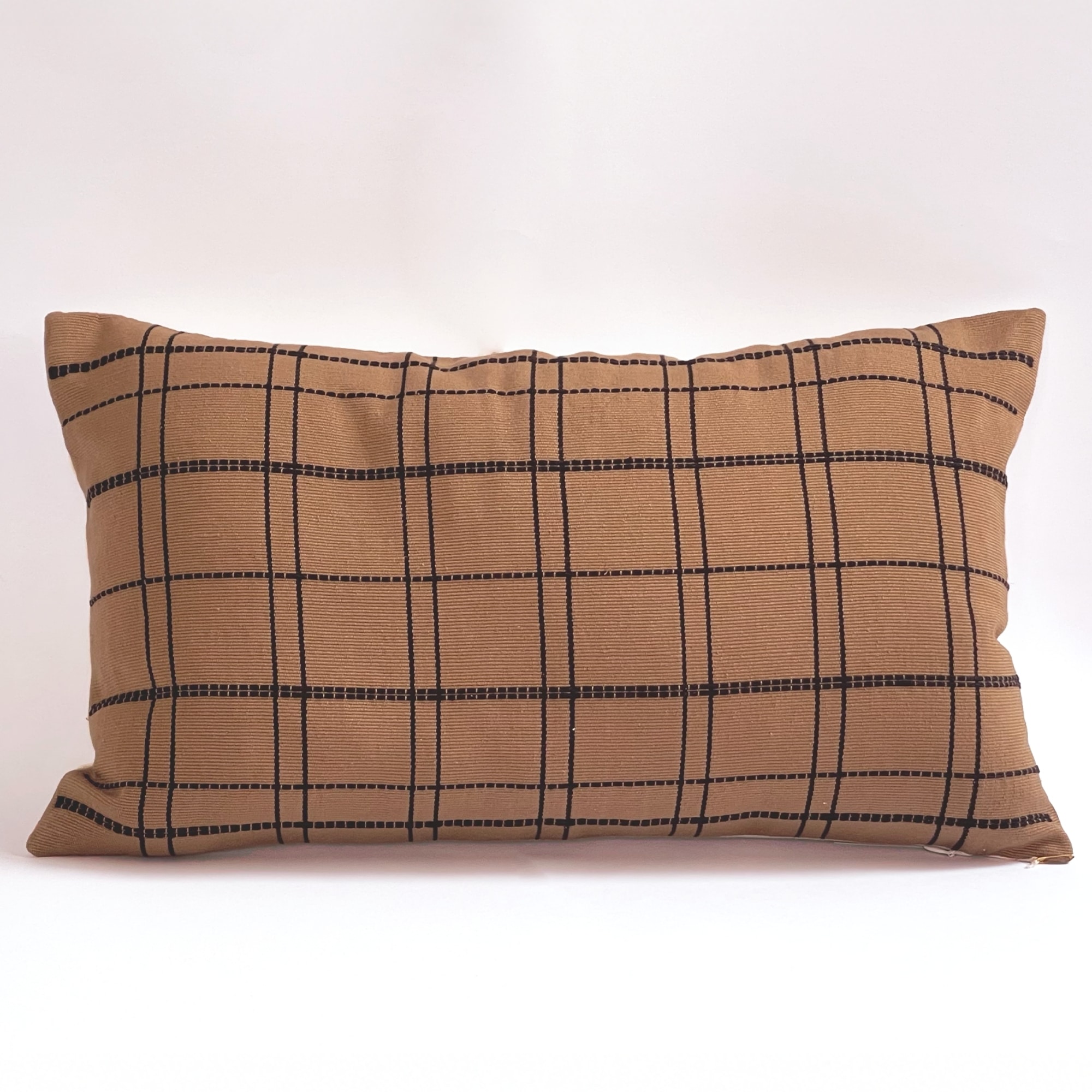 Tan pillow cover crafted by the artisans of Dos Tierras called the Grid Lumbar Pillow Cover Tan featuring handwoven textile, handcrafted shown against a clean backdrop featuring with a grid motif.