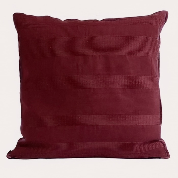 Burgundy pillow cover crafted by the artisans of Magnolia Casual called the Lines Pillow Cover Burgundy featuring handwoven textile, handcrafted shown against a clean backdrop featuring shades of burgundy.