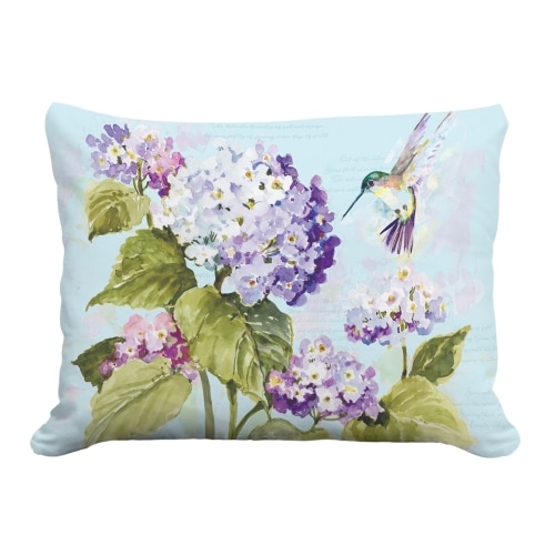 Multi colored outdoor pillow crafted by the artisans of Magnolia Casual called the Outdoor Pillow Hummingbird with Hydrangea 19x24 featuring handwoven textile shown against a clean backdrop featuring with a hummingbird motif.