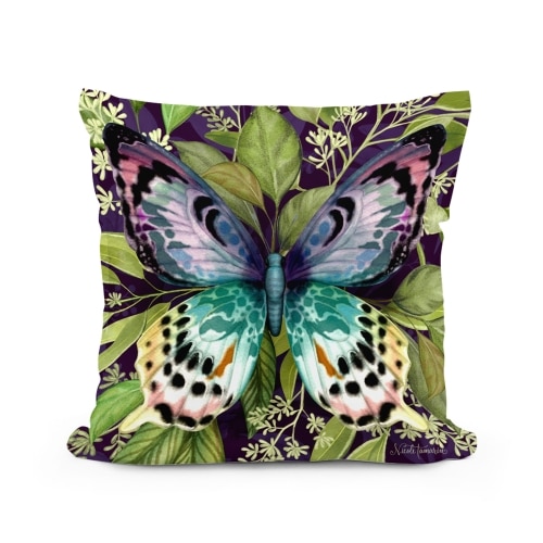 Multi colored outdoor pillow crafted by the artisans of Magnolia Casual called the Outdoor Pillow Mystic Butterfly 18x18 featuring quality outdoor fabric shown against a clean backdrop featuring with a butterfly motif.