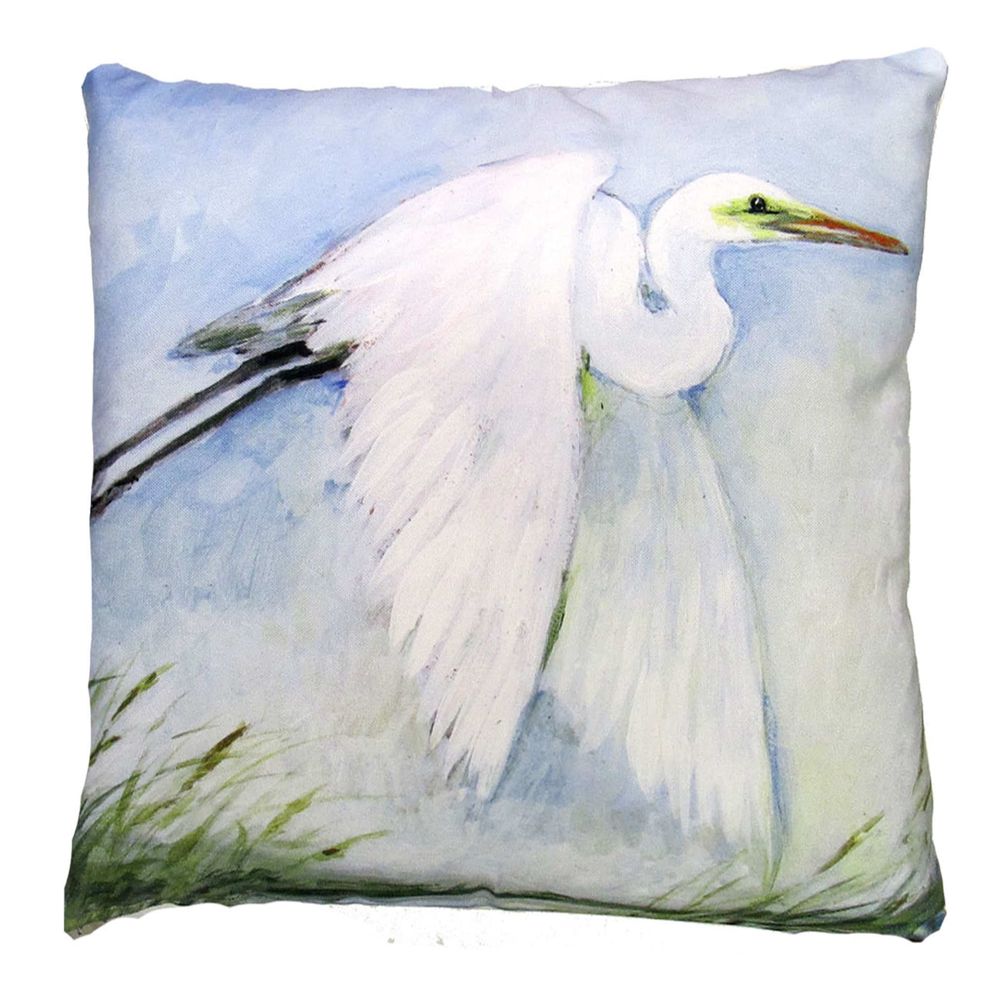 White outdoor pillow crafted by the artisans of Magnolia Casual called the Outdoor Pillow White Egret Flying 18x18 featuring quality outdoor fabric shown against a clean backdrop featuring shades of white.