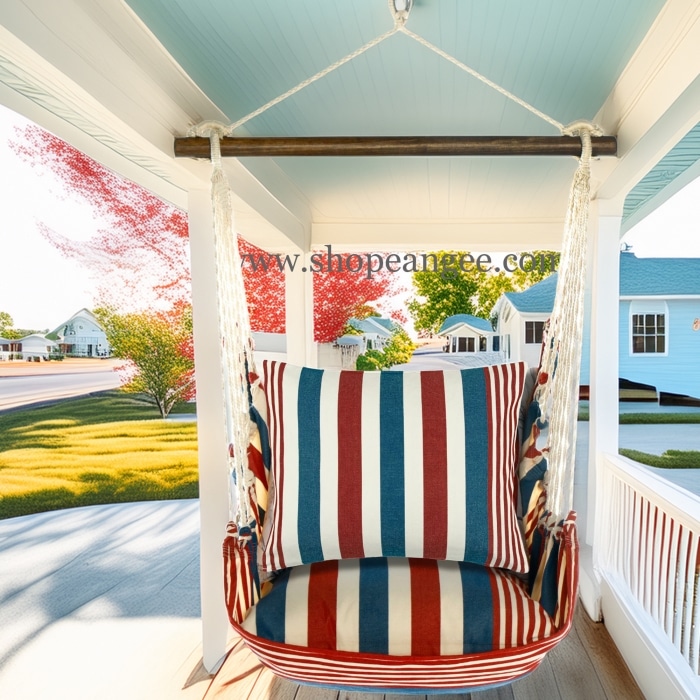 In a poolside chaise a multi colored outdoor swing crafted by the artisans of Magnolia Casual called the Swing Set 4 piece Stars & Stripes w/ Star & Stripe is displayed featuring 100 percent weather resistant fabric, weather resistant polyester fabric, handcrafted adding comfort and style to the space featuring with a stripes motif.